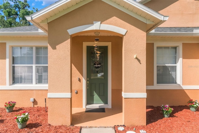 2619 Breezy Meadow Rd, Apopka, FL 32712 - entrance to property with stucco siding and roof with shingles