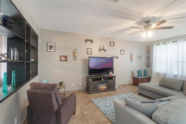 2619 Breezy Meadow Rd, Apopka, FL 32712 - living area featuring light tile patterned floors, a ceiling fan, and a textured ceiling