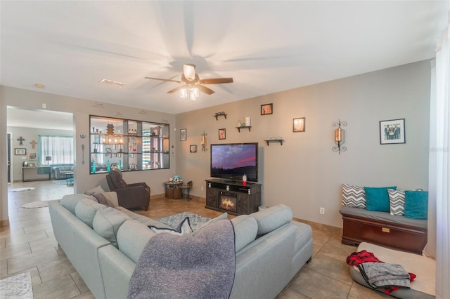 2619 Breezy Meadow Rd, Apopka, FL 32712 - living area with a ceiling fan and light tile patterned floors
