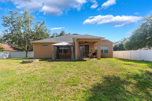 2619 Breezy Meadow Rd, Apopka, FL 32712 - back of house featuring a gazebo, stucco siding, and a ceiling fan