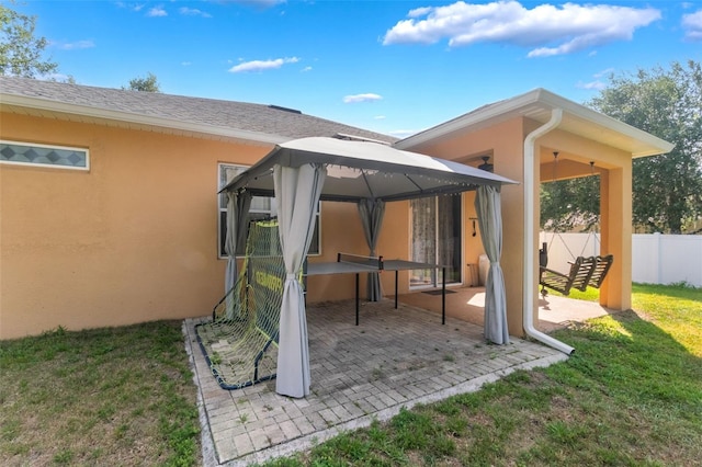 2619 Breezy Meadow Rd, Apopka, FL 32712 - rear view of property with a gazebo, stucco siding, and a patio