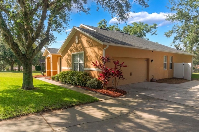 2619 Breezy Meadow Rd, Apopka, FL 32712 - view of home's exterior with stucco siding, concrete driveway, an attached garage, and a lawn