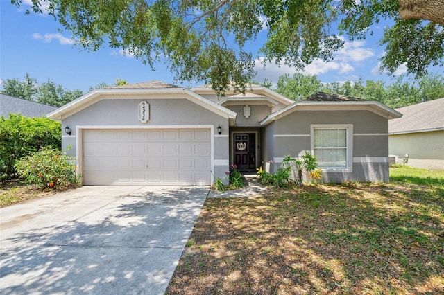 2354 Barons Ct, Tavares, FL 32778 - ranch-style house featuring an attached garage, driveway, and stucco siding