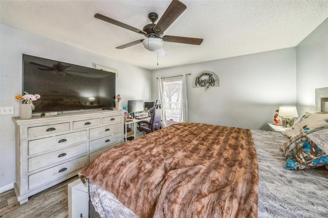 2354 Barons Ct, Tavares, FL 32778 - bedroom with wood finished floors, a textured ceiling, and ceiling fan