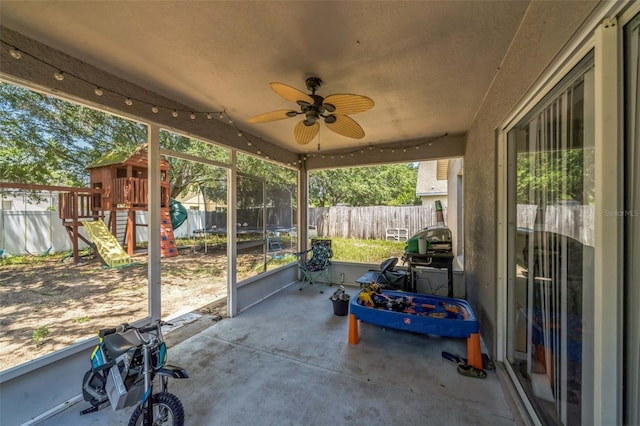 2354 Barons Ct, Tavares, FL 32778 - fenced backyard with a playground, a patio, ceiling fan, a trampoline, and grilling area