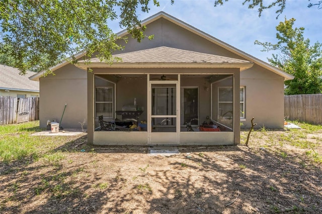 2354 Barons Ct, Tavares, FL 32778 - back of house featuring a sunroom and stucco siding