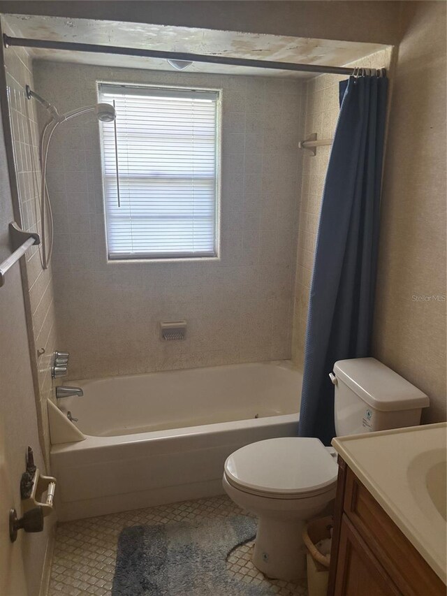 977 E Normandy Blvd, Deltona, FL 32725 - full bath with toilet, shower / bath combination with curtain, vanity, and tile patterned flooring