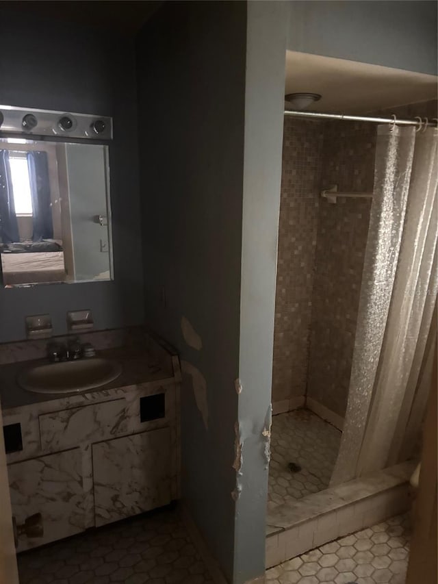 977 E Normandy Blvd, Deltona, FL 32725 - bathroom with a stall shower, vanity, and tile patterned flooring