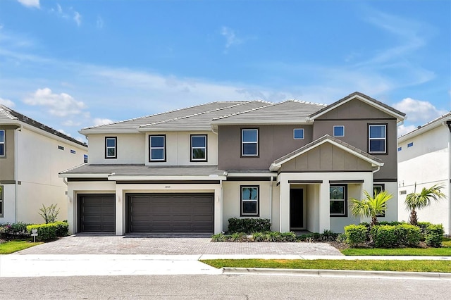 3860 Sonoma Blvd, Kissimmee, FL 34741 - traditional-style house with an attached garage, driveway, stucco siding, and a tiled roof