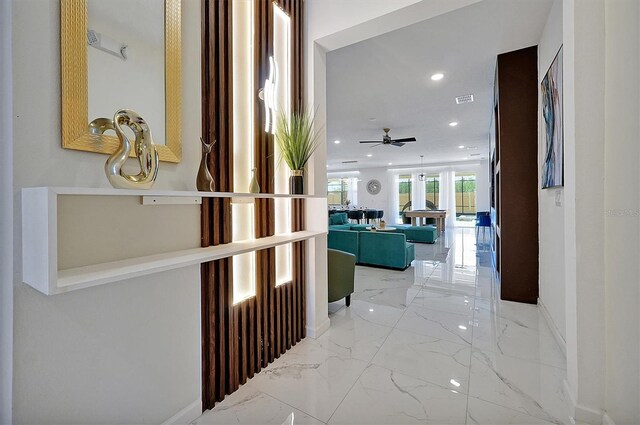 3860 Sonoma Blvd, Kissimmee, FL 34741 - hallway with marble tiled floors, baseboards, and recessed lighting