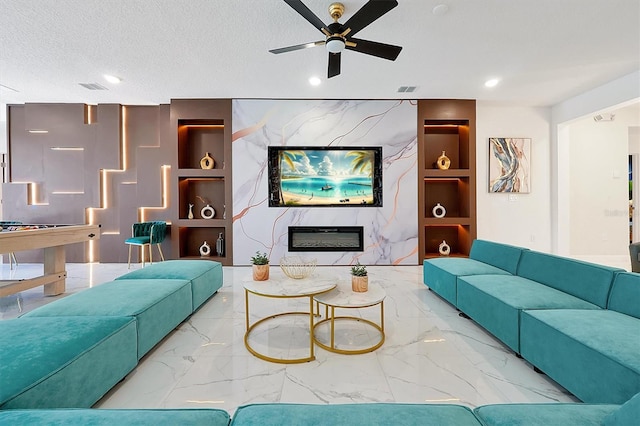 3860 Sonoma Blvd, Kissimmee, FL 34741 - living area featuring marble tiled flooring, a ceiling fan, recessed lighting, a high end fireplace, and a textured ceiling