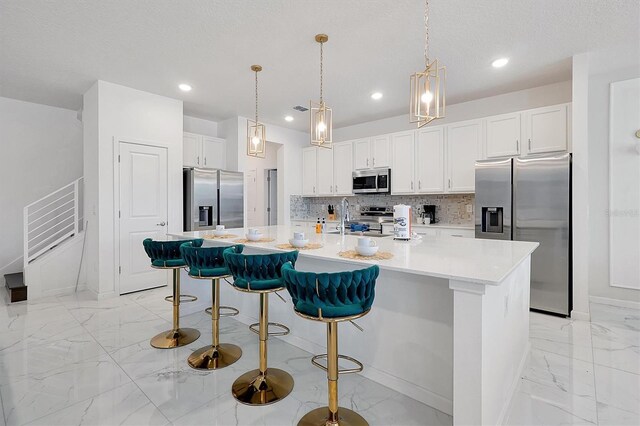 3860 Sonoma Blvd, Kissimmee, FL 34741 - kitchen with appliances with stainless steel finishes, light marble finish floors, baseboards, and recessed lighting
