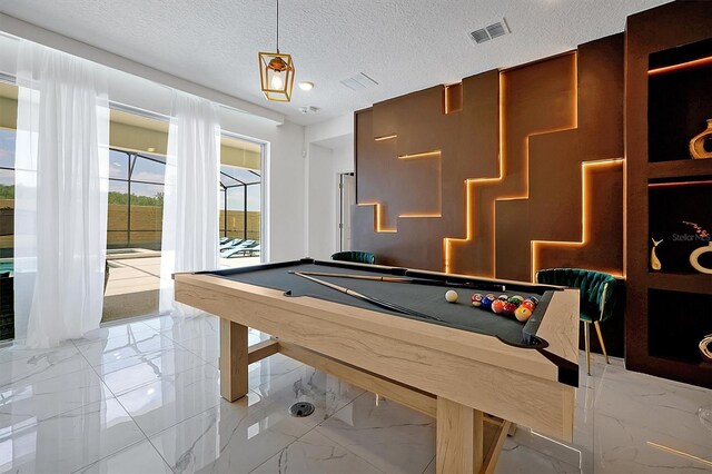 3860 Sonoma Blvd, Kissimmee, FL 34741 - rec room with light marble finish flooring, a textured ceiling, and pool table