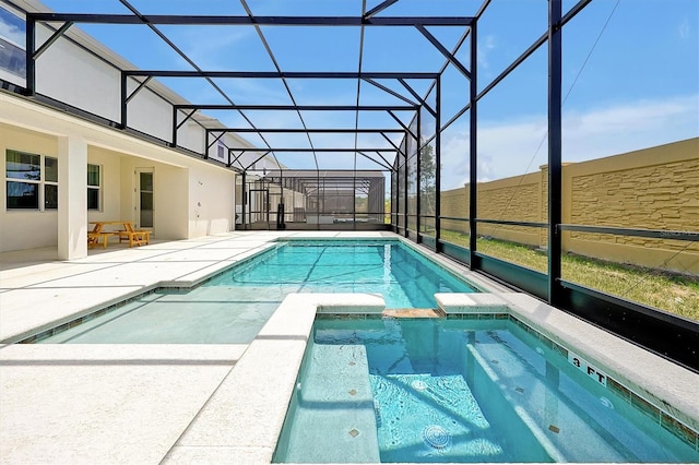 3860 Sonoma Blvd, Kissimmee, FL 34741 - view of swimming pool with a patio, a pool with connected hot tub, and glass enclosure