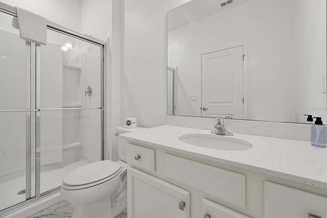 3860 Sonoma Blvd, Kissimmee, FL 34741 - bathroom with vanity, a shower stall, and toilet