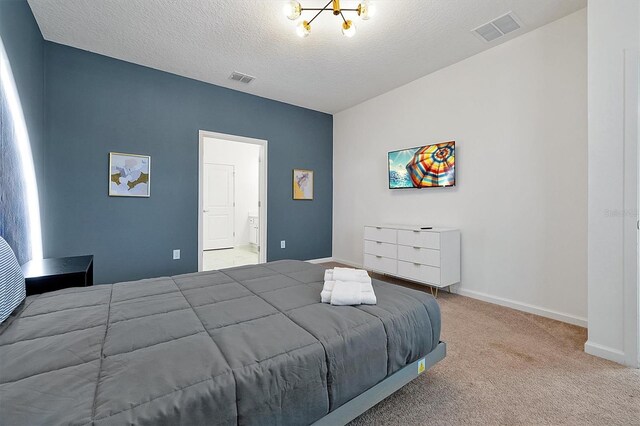 3860 Sonoma Blvd, Kissimmee, FL 34741 - carpeted bedroom featuring a chandelier, baseboards, a textured ceiling, and ensuite bathroom