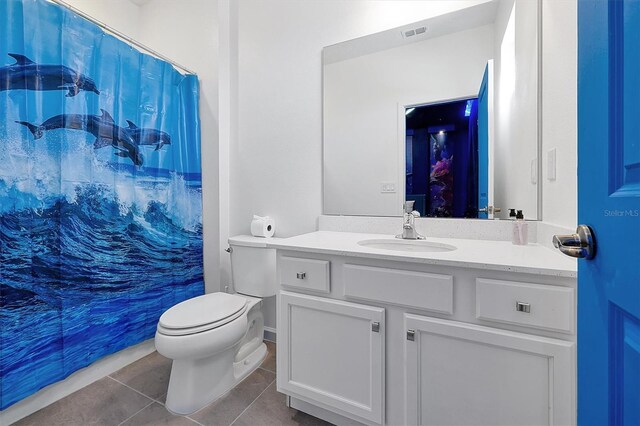 3860 Sonoma Blvd, Kissimmee, FL 34741 - bathroom featuring tile patterned flooring, toilet, and vanity