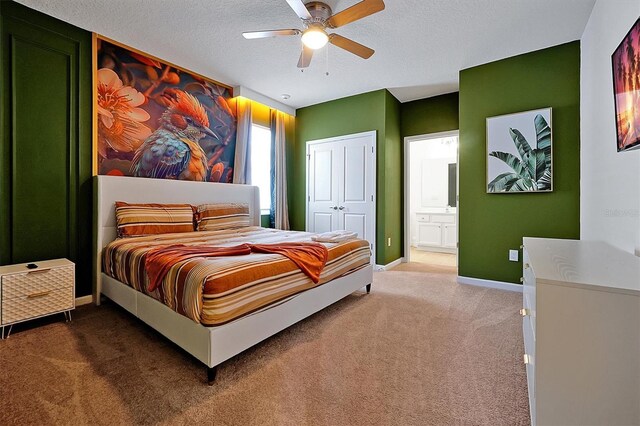 3860 Sonoma Blvd, Kissimmee, FL 34741 - bedroom with carpet, baseboards, a textured ceiling, ensuite bath, and a closet