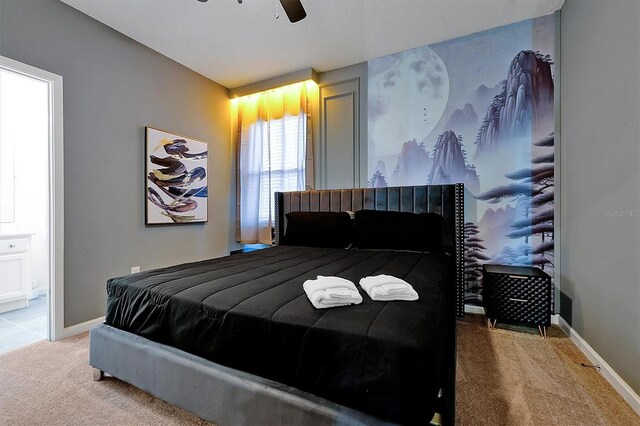 3860 Sonoma Blvd, Kissimmee, FL 34741 - carpeted bedroom featuring ensuite bathroom, baseboards, and ceiling fan