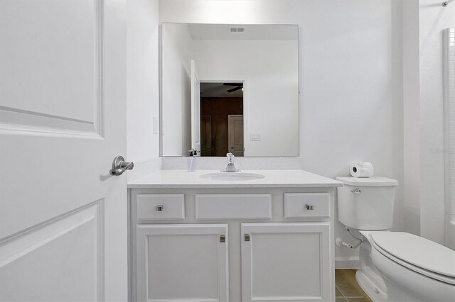 3860 Sonoma Blvd, Kissimmee, FL 34741 - bathroom featuring toilet, vanity, and tile patterned floors