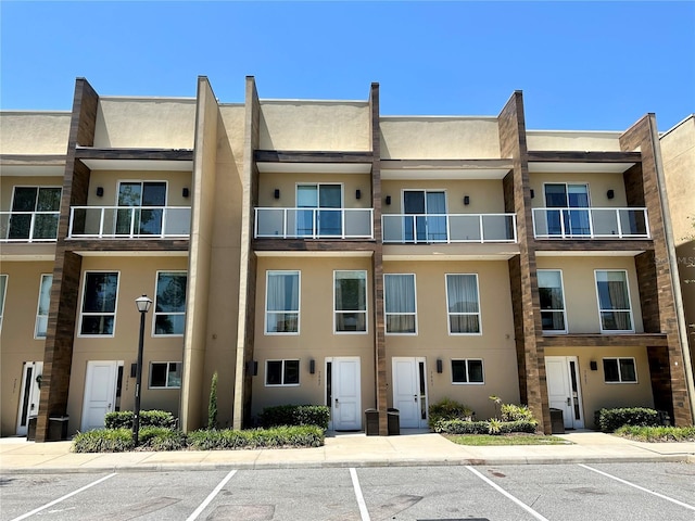 7667 Recife Dr, Kissimmee, FL 34747 - view of building exterior featuring uncovered parking
