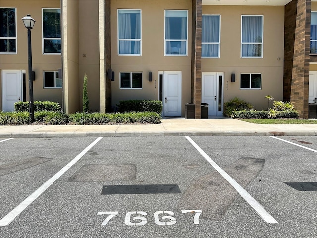 7667 Recife Dr, Kissimmee, FL 34747 - view of building exterior featuring uncovered parking