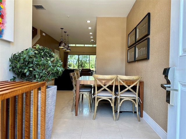 7667 Recife Dr, Kissimmee, FL 34747 - dining room with light tile patterned flooring and recessed lighting