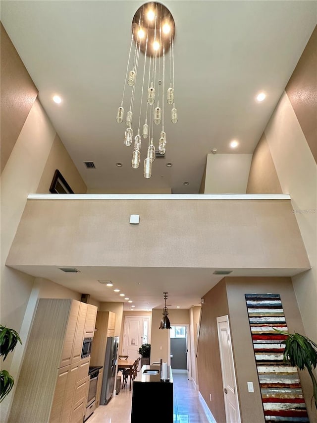 7667 Recife Dr, Kissimmee, FL 34747 - living area with recessed lighting, a towering ceiling, and baseboards