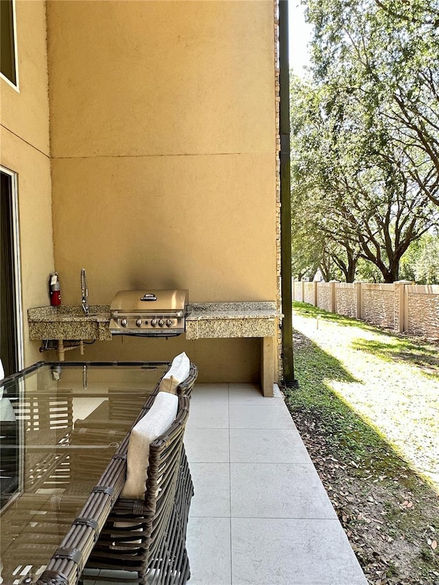 7667 Recife Dr, Kissimmee, FL 34747 - view of patio / terrace featuring area for grilling