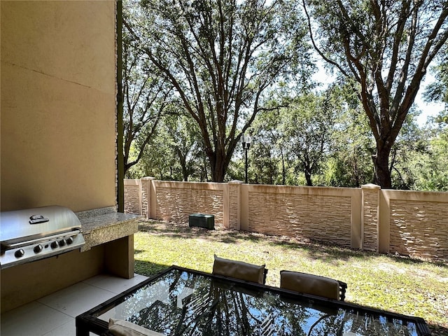7667 Recife Dr, Kissimmee, FL 34747 - view of patio featuring grilling area