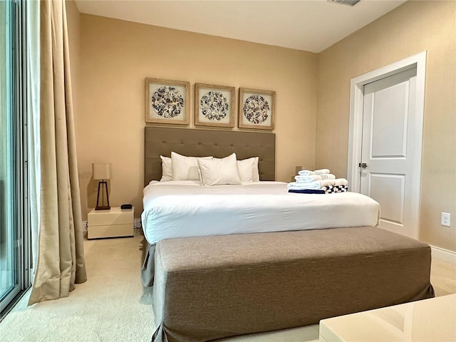 7667 Recife Dr, Kissimmee, FL 34747 - bedroom featuring light colored carpet and baseboards