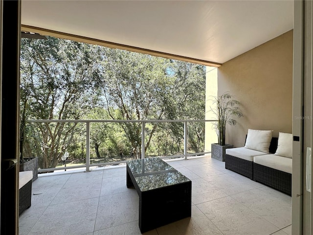 7667 Recife Dr, Kissimmee, FL 34747 - balcony with outdoor lounge area and view of scattered trees