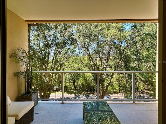 7667 Recife Dr, Kissimmee, FL 34747 - balcony featuring view of wooded area