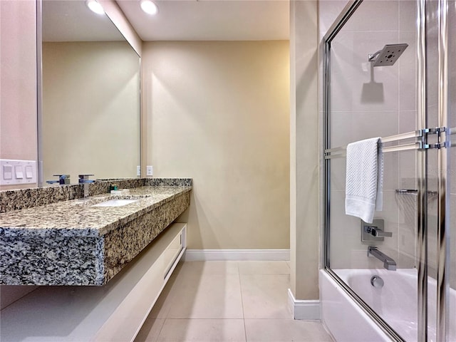 7667 Recife Dr, Kissimmee, FL 34747 - bathroom with vanity, shower / bath combination with glass door, baseboards, tile patterned floors, and recessed lighting