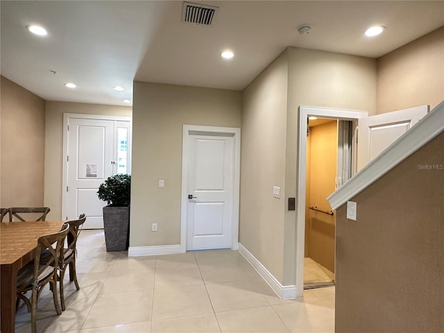 7667 Recife Dr, Kissimmee, FL 34747 - hall with recessed lighting, baseboards, and light tile patterned floors