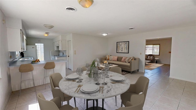 1119 Edith Dr, Daytona Beach, FL 32117 - dining space with light tile patterned floors