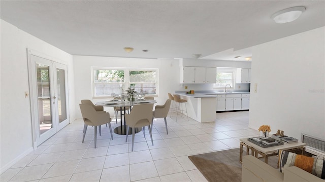 1119 Edith Dr, Daytona Beach, FL 32117 - dining space featuring light tile patterned floors and french doors