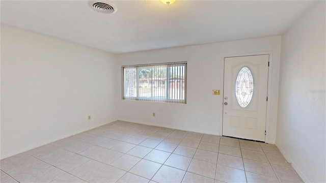 1119 Edith Dr, Daytona Beach, FL 32117 - foyer entrance featuring light tile patterned floors and baseboards