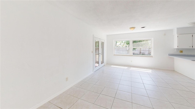 1119 Edith Dr, Daytona Beach, FL 32117 - spare room featuring light tile patterned floors and baseboards