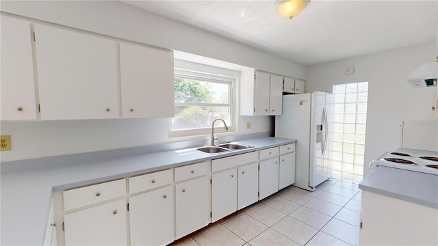 1119 Edith Dr, Daytona Beach, FL 32117 - kitchen featuring white appliances, light countertops, and white cabinetry
