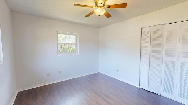 1119 Edith Dr, Daytona Beach, FL 32117 - unfurnished bedroom featuring dark wood-type flooring, a closet, and a ceiling fan
