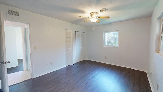 1119 Edith Dr, Daytona Beach, FL 32117 - unfurnished bedroom featuring wood finished floors, a closet, and a ceiling fan