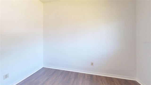1119 Edith Dr, Daytona Beach, FL 32117 - empty room featuring baseboards and dark wood-style flooring