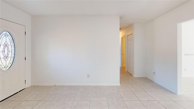 1119 Edith Dr, Daytona Beach, FL 32117 - entrance foyer featuring light tile patterned floors and baseboards