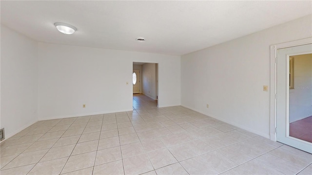 1119 Edith Dr, Daytona Beach, FL 32117 - empty room featuring light tile patterned flooring and baseboards