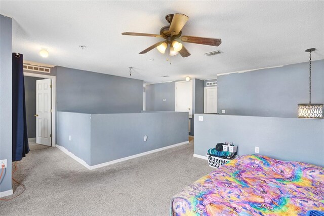 carpeted bedroom featuring baseboards and a ceiling fan