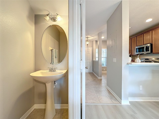 3309 Wilshire Way Rd Unit 3, Orlando, FL 32829 - bathroom with baseboards and a sink