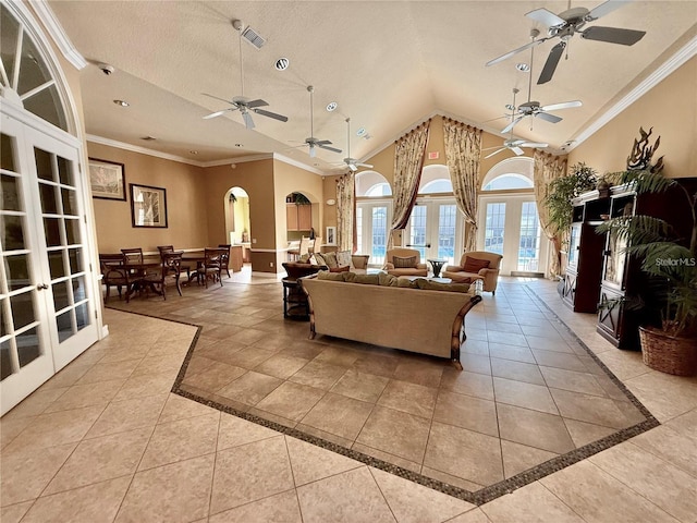 3309 Wilshire Way Rd Unit 3, Orlando, FL 32829 - living room with french doors, ceiling fan, inlaid floor details, light tile patterned floors, and ornamental molding