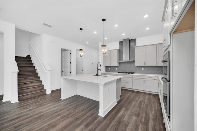 13081 Sunrise Harvest Dr, Winter Garden, FL 34787 - kitchen with wall chimney exhaust hood, a sink, tasteful backsplash, dark wood-style flooring, and recessed lighting