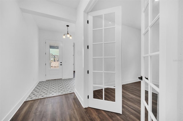 13081 Sunrise Harvest Dr, Winter Garden, FL 34787 - entryway featuring dark wood-style floors, baseboards, and a chandelier
